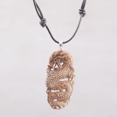 Primary image for Bone and Leather Dragon Pendant Necklace from Indonesia Snarling Dragon